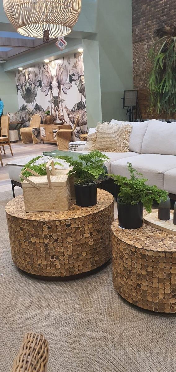 Cocora coconut shell coffee tables in a lounge setting with a sofa and rattan chairs, Karya Kreatif Indonesia 2026