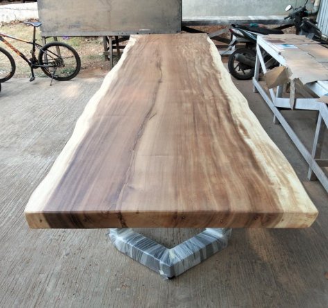 UV-coated Suar tabletop seen from one end